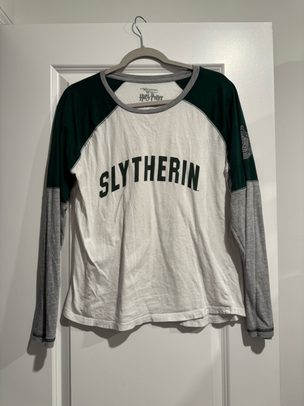 Warner Bros. White Tee with Gray Trim and Dark Green Accents